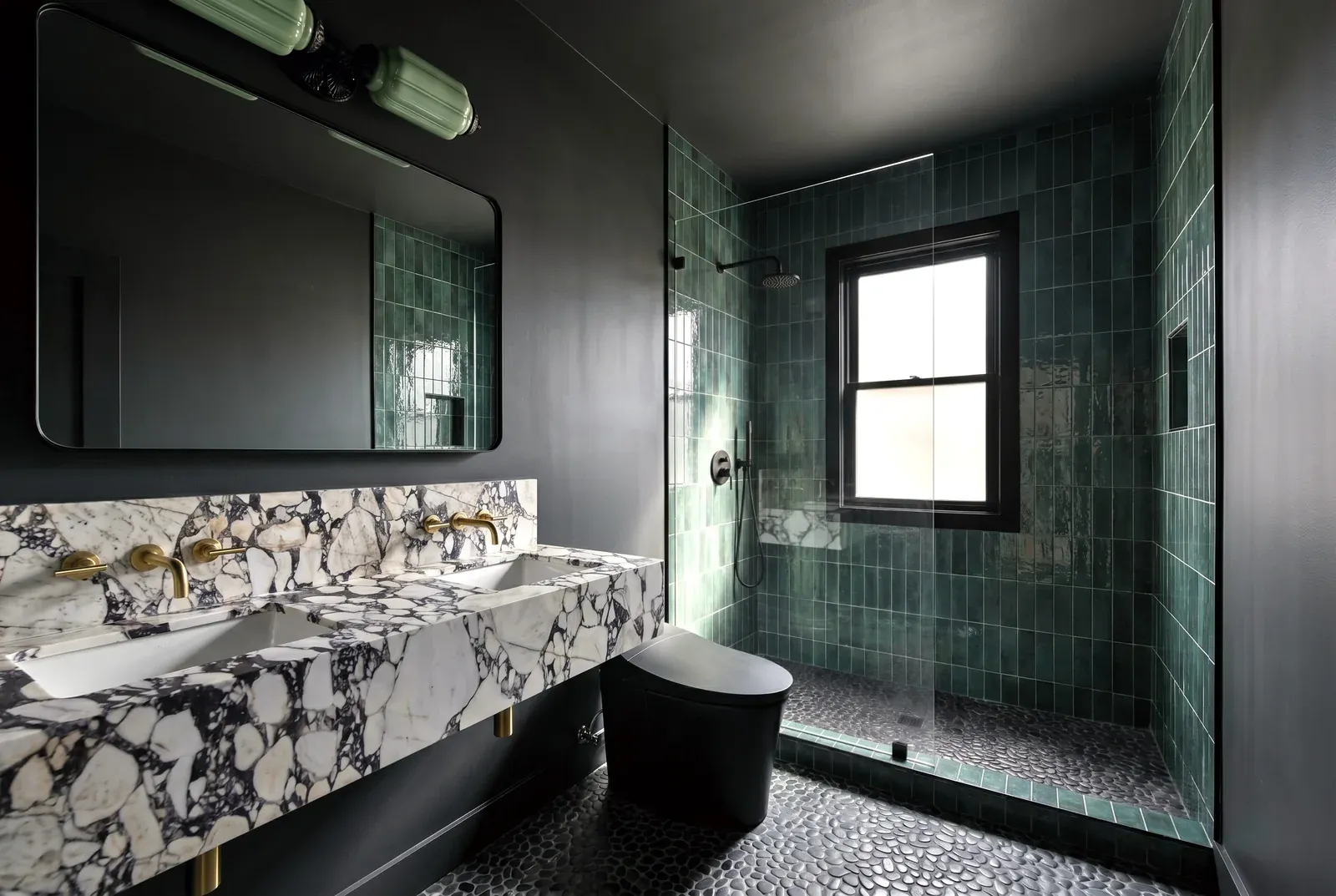 Bathroom remodel in Travis Heights, Austin, TX with green tile walls and a marble vanity