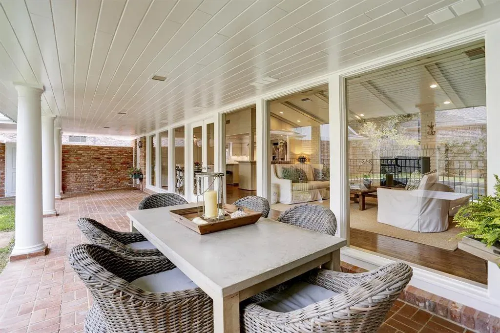 Before: Exterior remodel in Barton Creek, Austin, TX with a white paneled porch and brick paving