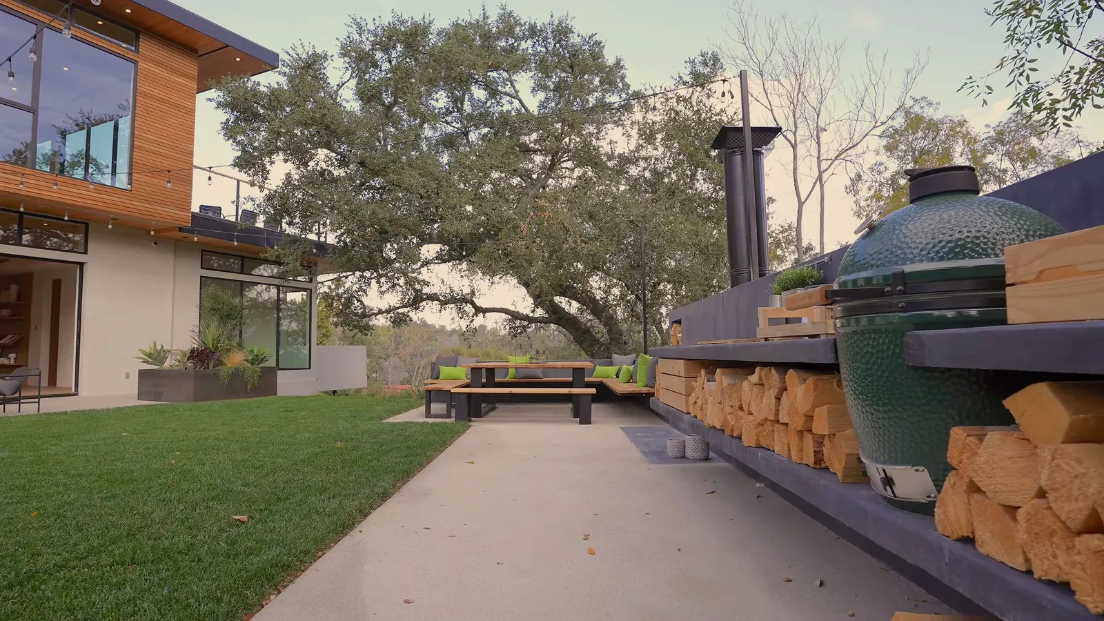 Exterior remodel in Westlake Hills, Austin, TX with a concrete patio and a built-in outdoor kitchen