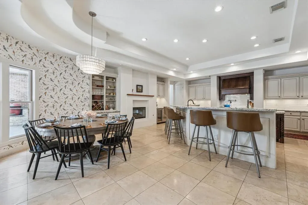 Before: Kitchen remodel in Westlake Hills, Austin, TX with beige tile floors and a dark wood island