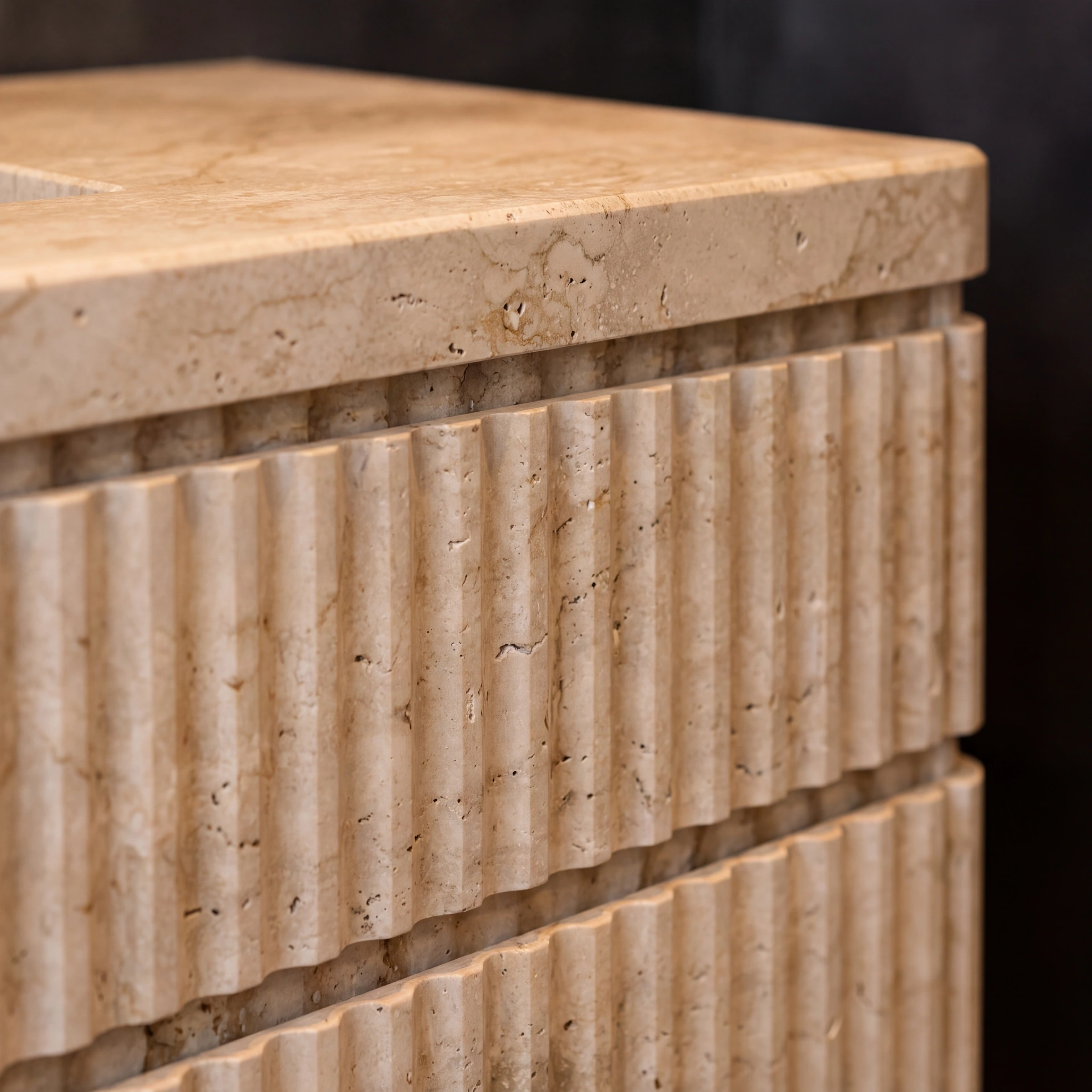 Handcrafted travertine sink with brass fixtures